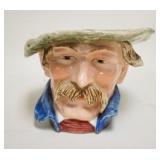 1186	FIGURAL PLANTER, MAN W/MOUSTACHE, CHIPS ON ONE SIDE OF THE COLLAR, HAS UNDERGLAZE NUMBERS 8613,