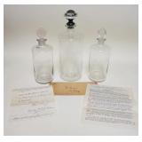 1192	3 ELIZABETH ARDEN LARGE SCENT BOTTLES W/1934 PAPERWORK, TALLEST IS 13 1/2 IN