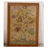 1218	FLORAL EMBROIDERY IN A BIRDSEYE MAPLE FRAME, SOME VENEER LOSS AT THE TOP OF THE FRAME, 21 1/4 I