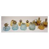 1298	11 FOSTORIA COIN LAMPS, 4 LIGHT BLUE & 7 AMBER, 3 ARE ELECRIC, 3 DON