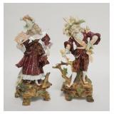 1323	PAIR OF PORCELAIN FIGURES, MAN & WOMAN, HAVE MAKERS MARK, EACH HAS A BROKEN BRANCH, SHE HAS A F