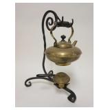 1023	BRASS TEAPOT ON FANCY WROUGHT IRON STAND W/WARMER, APPROXIMATELY 14 1/2 IN HIGH