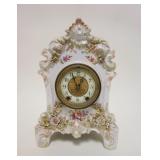 1050	WATERBURY ROYAL BONN CHINA CLOCK W/APPLIED FLOWER DECORATION, APPROXIMATELY 8 IN X 5 1/4 IN X 1