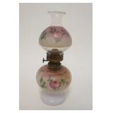 1076	MINIATURE KEROSENE LAMP W/MILK GLASS FONT & HAND PAINTED FLOWERS, APPROXIMATELY 9 1/2 IN HIGH
