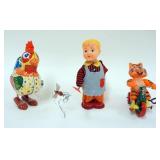 1253	LOT OF 4 VINTAGE WIND UP TOYS, INCLUDING MARX