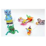 1254	LOT OF 4 VINTAGE WIND UP AND FRICTION TOYS