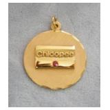 1288	12K CHICOPEE MEDALLION WITH RED STONE, 4.3 DWT INCLUDING STONE