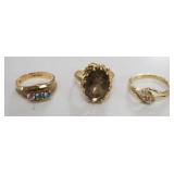 1313	3 10K LADIES RINGS, MAY BE GOLD FILLED, MARKINGS UNCLEAR, 5.56 DWT INCLUDING STONES