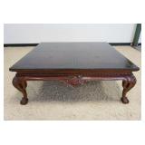 1048	MAHOGANY COCKTAIL TABLE W/SHELL CARVED SKIRT, BALL & CLAW LEGS & LEATHER TOP W/GILT TRIM, APPRO