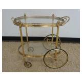 1084	BRASS TEACART W/REMOVABLE GLASS SERVING TRAY TOP, APPROXIMATELY 29 IN X 17 IN X 26 IN