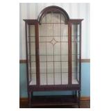 1104	IRISH MAHOGANY CURIO CABINET WITH INDIVIDAL GLASS PANED DOOR AND SIDES WITH ARCHED TOP AND BOTT