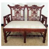 1105	MAHOGANY ASIAN LOVE SEAT WITH CARVED PAGODA CREST AND ARMS, APPROXIMATELY 46 IN X 23 IN X 38 IN