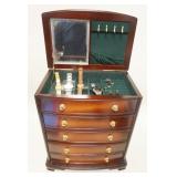 1127	JEWELRY CHEST WITH WATCHES AND AN ASSORTMENT OF COSTUME JEWELRY , CHEST APPROXIMATELY 14 IN X 9