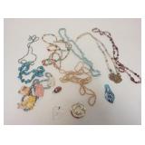 1173	10 BEADED NECKLACES INCLUDING ONE CERAMIC CAT NECKLACE SIGNED & 4 PENDANTS INCLUDING ART GLASS 