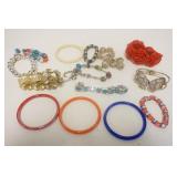 1174	15 COSTUME BRACELETS INCLUDING GLASS BANGLES