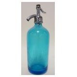 1221	BLUE SELTZER BOTTLE L&M BEER, APPROXIMATELY 11 1/2 IN HIGH