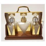 1054	ART DECO 3 BOTTLE DECANTOR SET IN LOCKING WOOD HOLDER, ONE STOPPER W/DAMAGE, APPROXIMATELY 14 1