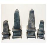 1095	LOT OF 4 METAL OBELISKS, TALLEST IS APPROXIMATELY 21 IN HIGH