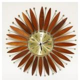 1015	MIDCENTURY MODERN WALL CLOCK FLANKED BY MAHOGANY WOOD SURFBOARD SHAPED PIECES & METAL RODS W/SP