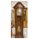1243	HOWARD MILLER GRANDFATHERS CLOCK IN OAK CASE, APPROXIMATELY 22 IN X 12 IN X 79 IN H
