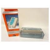 1293	MID CENTURY MODERN FRENCH LUCITE TISSUE HOLDER IN ORIGINAL BOX, MARKED BLUE CRYSTAL COLOR