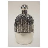 1001	SILVER FLASK WITH TOUCHMARKS ON NECK AND BASE. APPROXIMATELY 6 1/4 IN HIGH AND GLASS LINED