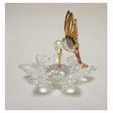 1007	SWAROVASKI CUT CRYSTAL FIGURE OF HUMMINGBIRD WITH BEAK IN FLOWER, HAVING GILT METAL ACCENTS, AP