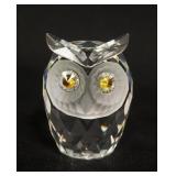 1009	SWARVOSKI CUT CRYSTAL FIGURINE OF AN OWL WITH CITRON CRYSTAL EYES, APPROXIMATELY  2 3/4 IN H