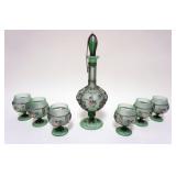 1093	GREEN SATIN GLASS DECANTOR W/6 FOOTED GLASSES ALL HAVING INTRICATE SCROLLED WIRE APPLIED, TALLE