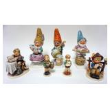 1112	LOT OF 7 GOEBEL HUMMELS INCLUDING 8 1/2 IN HIGH GNOMES, ONE DAMAGED HANDLE