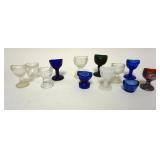 1170	GROUP OF 12 EYE WASH CUPS INCLUDING MILK, COBALT AND CARNIVAL GLASS