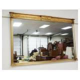 1219	MIRROR IN GILT FINISHED FRAME WITH REEDED COLUMNS, APPROXIMATELY 43 IN X 28 IN H