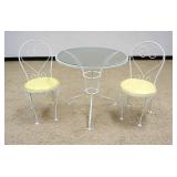 1223	3 PIECE DIMINUTIVE PORCH OR PATIO BREAKFAST SET, IRON BASE TABLE WITH GLASS TOP AND 2 SIDE CHAI