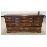 1238	CHEST OF DRAWERS WITH CHERRY FINISH, HAVING 8 DRAWERS, APPROXIMATELY 63 IN X 18 IN X 32 IN