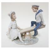 1024	LLADRO PORCELAIN FIGURE OF BOY & GIRL ON SEE-SAW, ONE FINGER DAMAGED, APPROXIMATELY 10 IN HIGH