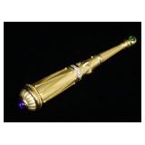 1173	18K TWO TONE GOLD BROOCH PIN CONTAINING ONE PURPLE & ONE GREEN COBACHON STONES & APP. 0.35 CARA