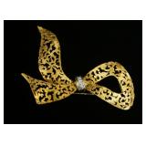 1178	14K YELLOW GOLD BROOCH PIN CONTAINING APP. 0.09 CARATS OF DIAMONDS. OVERALL WEIGHT 7.45 DWT