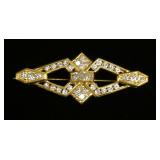 1183	18K YELLOW GOLD BROOCH PIN CONTAINING APP. 1 CARATS OF DIAMONDS. OVERALL WEIGHT 5.65 DWT