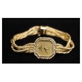 1185	14K GOLD BAUME & MERCIER LADIES WATCH. APP. 7 3/4 IN L. OVERALL WEIGHT 19.65 DWT 