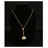 1190	14K GOLD CARVED JADE PENDANT W/ GOLD FILLED CHAIN. CHAIN APP. 28 IN L 