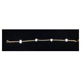 1191	14KT YELLOW GOLD STATION NECKLACE, 1.50 DWT & CONTAINING APPROXIMATELY 0.15 CARATS OF DIAMONDS,