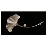1192	PLATINUM & 18 KT YELLOW GOLD LEAF BROOCH, 8.80 DWTS & CONTAINING ONE DIAMOND APPROXIMATELY 0.24