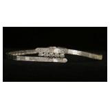 1199	14KT WHITE GOLD BYPASS STYLE BRACELET, 8.75 DWTS & CONTAINING APPROXIMATELY 0.35 CARATS OF DIAM