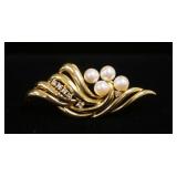 1203	14KT YELLOW GOLD BROOCH, 8.65 DWTS & CONTAINING 4 CULTURED AKOYA PEARLS & APPROXIMATELY 0.15 CA