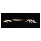 1210	18KT 2 TONE GOLD BROOCH, 7.30 DWTS & CONTAINING APPROXIMATELY 1.00 CARATS OF CLEAR & BROWN DIAM