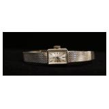 1216	14KT WHITE GOLD OMEGA WIND UP LADYS WATCH. 13.4 DWTS
