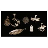1298	LOT OF 7 SILVER PENDANTS ALL MARKED STERLING EXCEPT THE JOCKEY WHICH TEST POSITIVE FOR SILVER, 