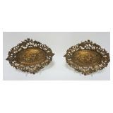 1063	PAIR OF ORNATE OVAL BRASS FOOTED TRAYS W/NEOCLASSICAL SCENES, APPROXIMATELY 13 1/2 IN X 9 IN