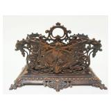 1064	ORNATE BRASS LETTER HOLDER, APPROXIMATELY 5 IN X 9 IN X 7 IN HIGH