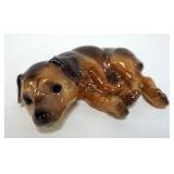 1153	GOEBEL LAYING DOWN DOG FIGURINE APPROXIMATELY 10 IN X 3 IN H